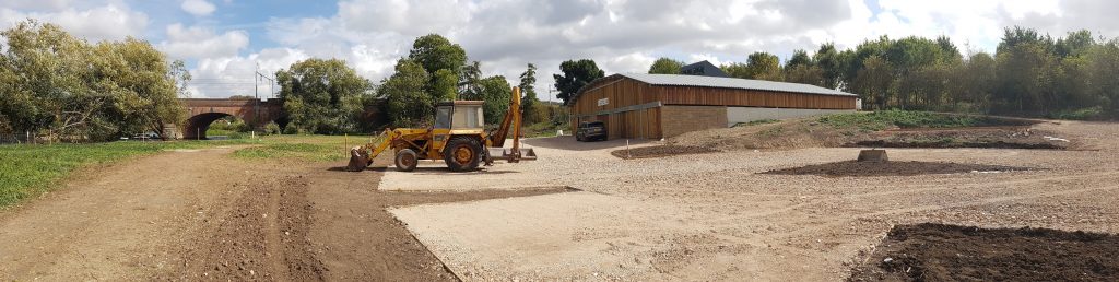 Photo of the new car park at the boathouse plus digger